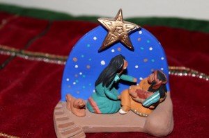 Nativity from Apache Indian tribe.  The father holds the Christ Child in their Nativity scenes.