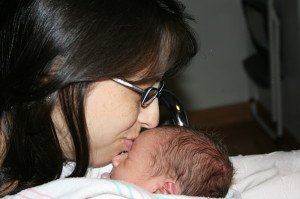 Gina kissing baby Jayden